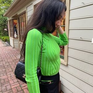 Green turtleneck long sleeve sweater